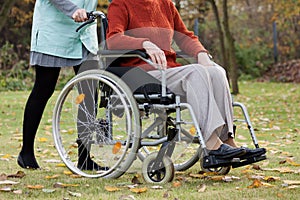 Nurse pushing wheelchair