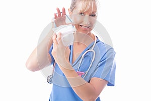 Nurse putting on a respirator P2 N95 respirator mask