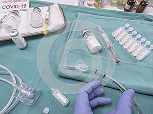 Nurse refilling medication solution nebulizer container, along with medical treatment with Dexamethasone and heparin