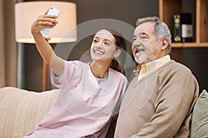 Nurse, selfie and old man in nursing home with smartphone and smile for picture, caregiver and retirement. Health