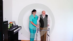 Nurse and senior man using walking frame