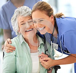 Nurse, senior woman and happy hug of caregiver and smile with support and care in hospital. Wheelchair, patient and