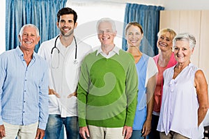 Nurse and seniors standing together