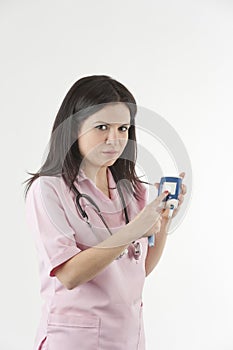 Nurse shows diabetic numbers on saccharometer