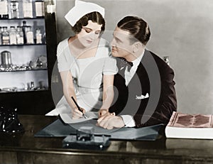 Nurse sitting on the doctor's lap