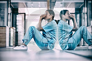 Nurse sitting on floor