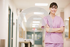 Nurse Standing In A Hospital Corridor