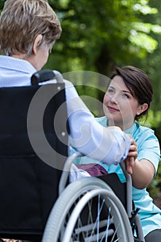 Nurse supports the older a woman with a disability