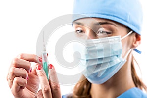 A nurse with syringe in her hand.