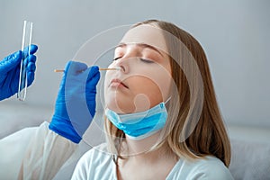 Nurse take saliva sample through nose with cotton swab check coronavirus covid 19 test. Diagnostics testing patients coronavirus