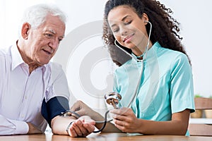 Nurse taking blood pressure