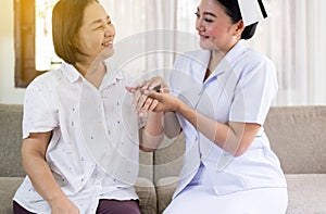 Nurse taking care of her patient mature asian elderly woman,Senior healthy concept