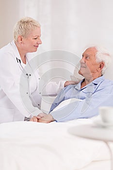 Nurse taking care about patient