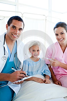 A nurse taking her patient's temperature