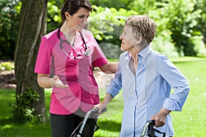 Nurse talking with disabled lady