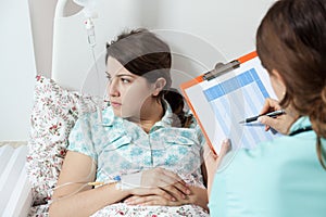 Nurse talking with ill patient