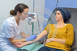 Nurse talking to patient having chemotherapy