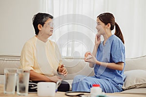 nurse teaches the elderly how to clean teeth at home