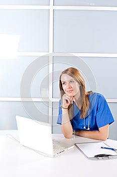 Nurse thinking in a modern office