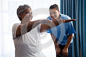 Nurse training woman in nursing home