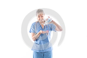 Nurse using or demonstrating hand sanitizer photo