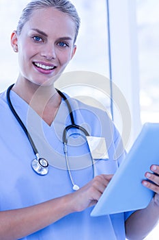 Nurse using her tablet pc