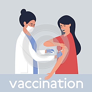 A nurse vaccinates a woman