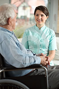 Nurse visiting disabled patient