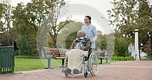 Nurse, walking and park with old woman in a wheelchair for retirement, elderly care and physical therapy. Trust, medical