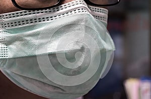 Nurse waring surgical mask in patients ward,medical care. Universal precaution. photo