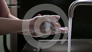 Nurse washes hands for covid-19 safety protocol.