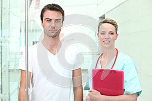 Nurse watching young patient