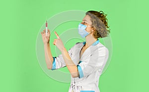 Nurse wear respirator mask. Physician giving vaccine. HPV concept. Doctor with syringe is preparing for injection