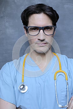 Nurse wearing blue scrubs and yellow stethoscope