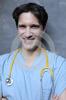 Nurse wearing blue scrubs and yellow stethoscope