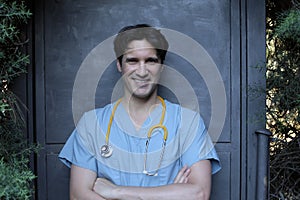 Nurse wearing blue scrubs and yellow stethoscope