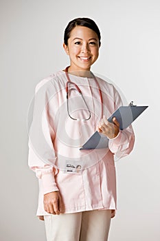 Nurse wearing scrubs and stethoscope
