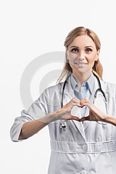 Nurse in white coat showing hears