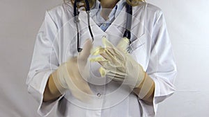 Nurse white uniform and stethoscope uncover white sterile glove