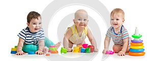 Nursery babies playing with toys isolated on white background