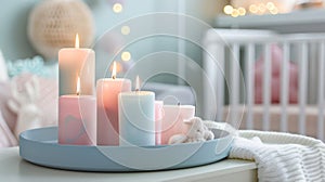 In the nursery a collection of pastel colored candles on a trendy tray adds a touch of softness and warmth to the room