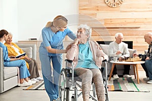 Nurses assisting elderly people
