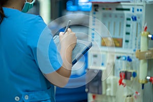 Nurses are checking the function of the hemodialysis machine