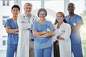 Nurses, portrait and team of doctors with arms crossed standing together in hospital. Face, confident and medical