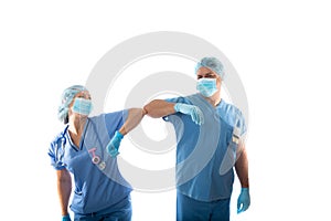 Nurses in scrubs elbow bump instead of shaking hands during COVID-19 pandemic photo
