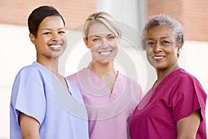 Nurses Standing Outside A Hospital