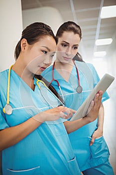 Nurses using digital tablet