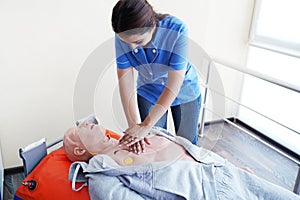 Nursing student learning how to rescue the patients in emergency. CPR training with CPR doll