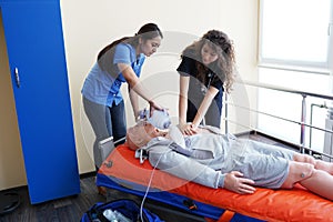 Nursing students are learning how to rescue the patients in emergency. CPR training with CPR doll