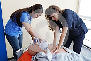 Nursing students are learning how to rescue the patients in emergency. CPR training with CPR doll